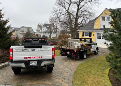 A white truck parked in front of a house.