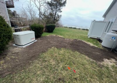 A backyard with a generator and water heater, providing backup power and hot water.